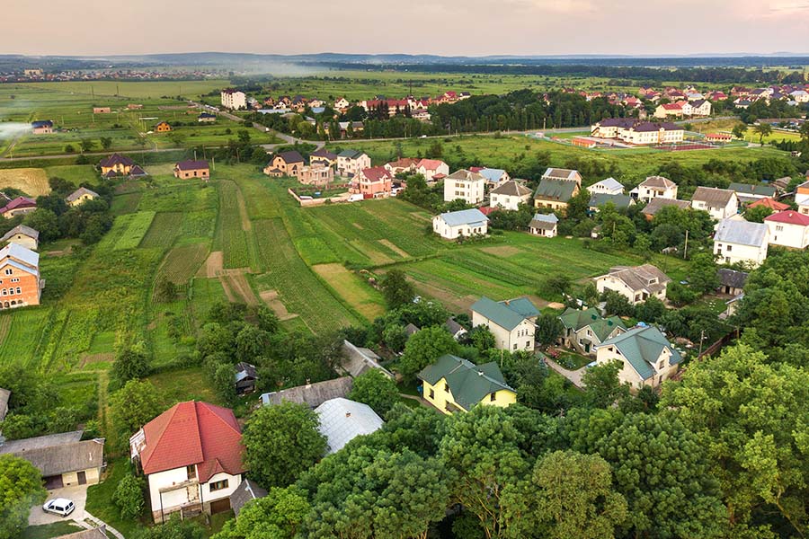 Clayton, GA - Aerial Landscape View of a Small Town With Rows of Homes and Green Trees